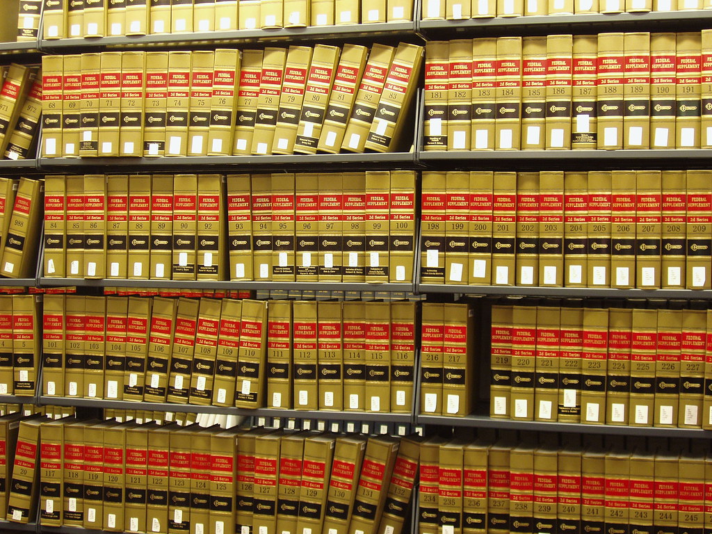 A bookshelf with many volumes of the Federal Supplement reporter